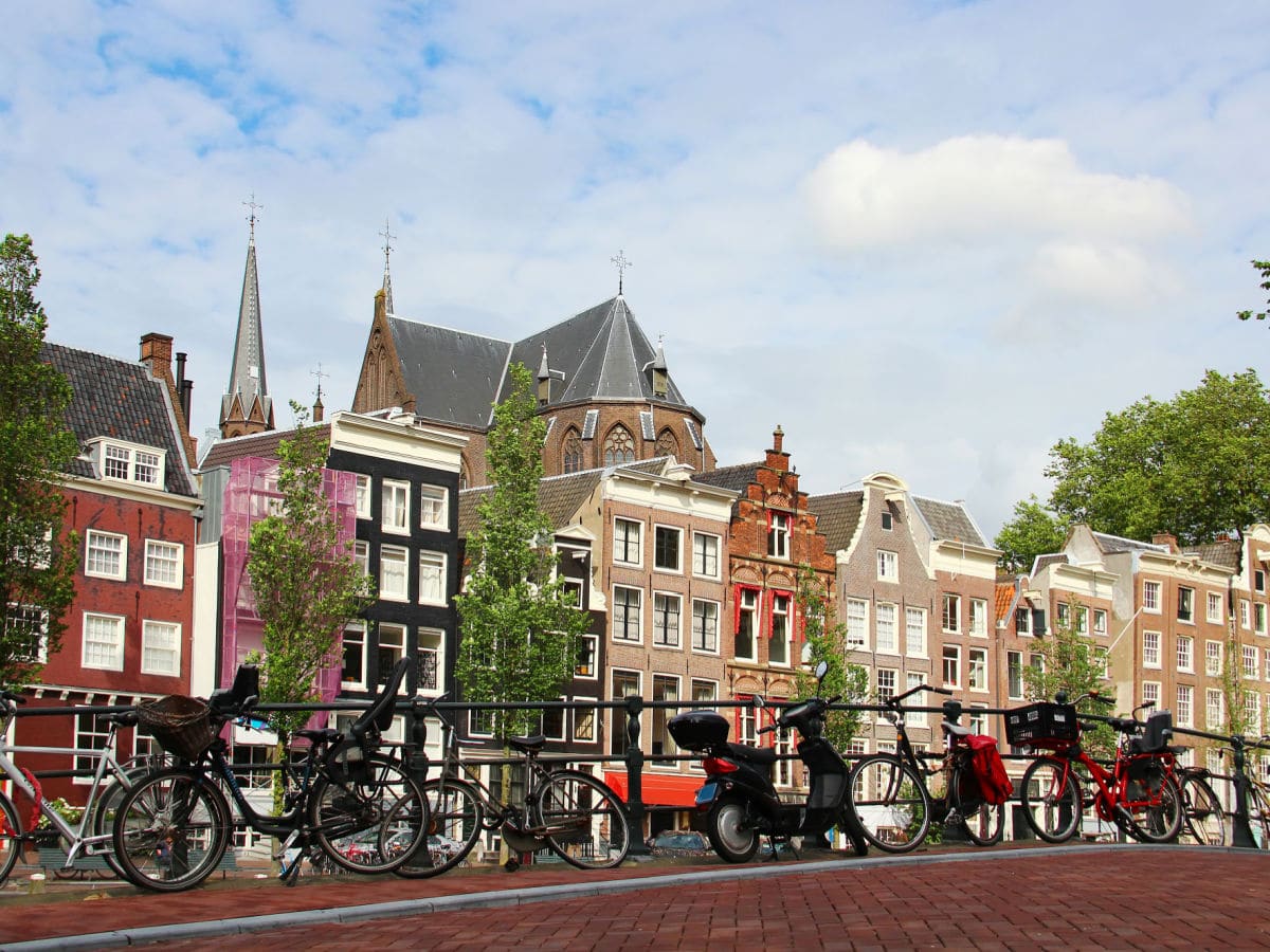 streets of amsterdam with a row of bikes