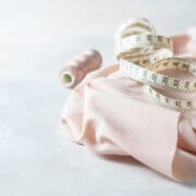 fabric and measuring tape on a white background