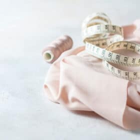 fabric and measuring tape on a white background