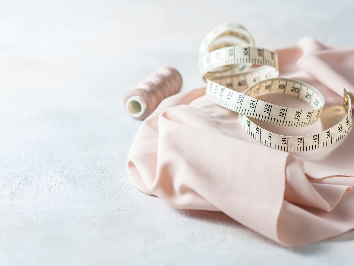 fabric and measuring tape on a white background
