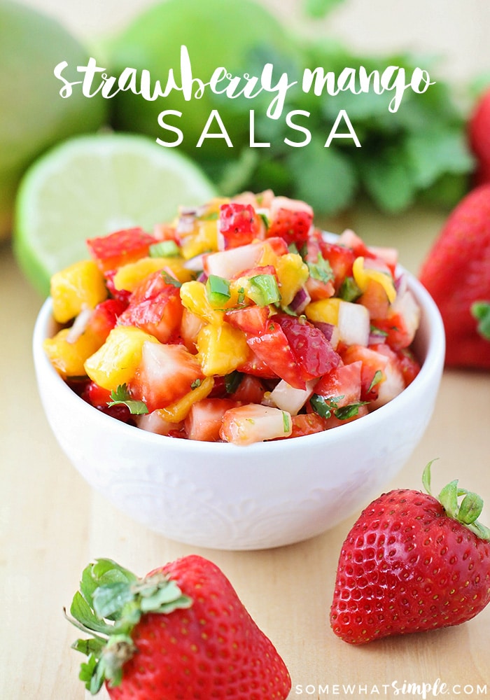 This sweet strawberry mango salsa is so fresh and fantastic! It's delicious with chips or on tacos or enchiladas, and it's the perfect side dish for summer! Made with fresh fruit and and vegetables, you won't be able to resist this salsa recipe. #strawberrymangosalsa #freshmangosalsa #easysalsarecipe #mexicanappetizer #mangosalsaforfish via @somewhatsimple