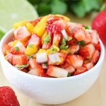 a bowl of strawberry mango salsa