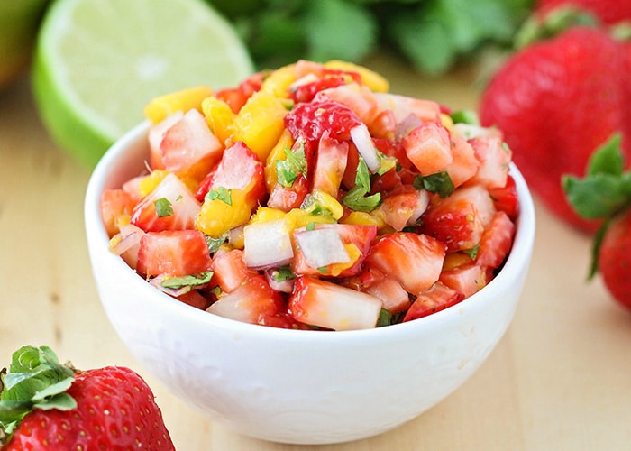 a bowl of strawberry mango salsa