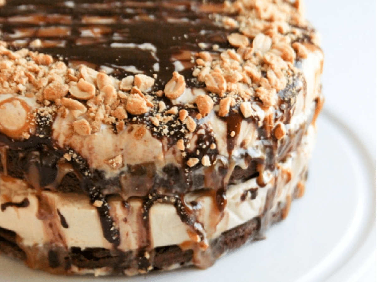 round ice cream cake with chocolate and peanuts
