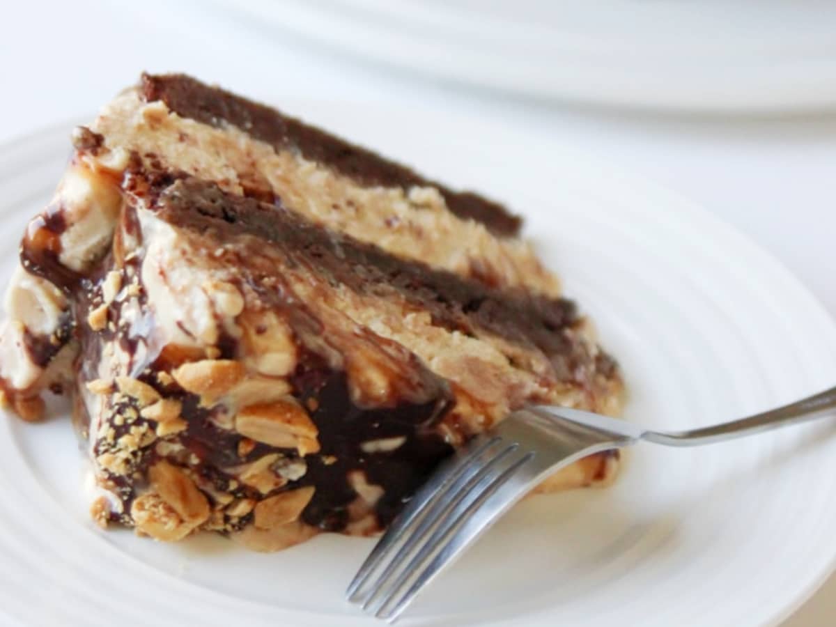 slice of snickers cake on a white plate