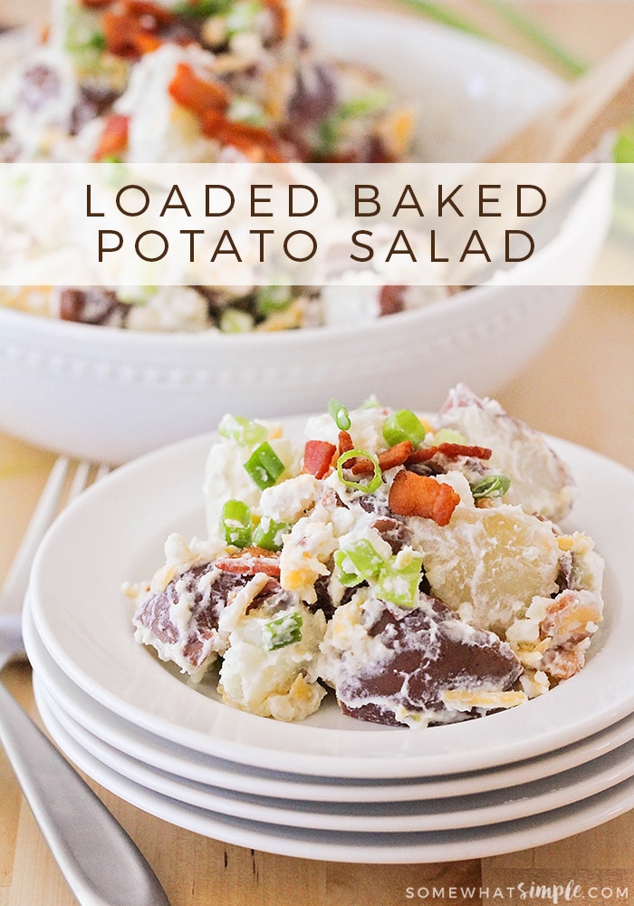 Loaded baked potato salad a delicious side dish to serve for dinner or bring with you to a potluck or summer BBQ.  Topped with bacon, green onions and cheese this delicious potato salad has all of the flavor of a loaded baked potato but in the form of a salad! #loadedbakedpotatosalad #potatosalad #loadedbakedpotatosaladrecipe via @somewhatsimple