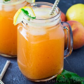 mason jars filled with fresh peach lemonade