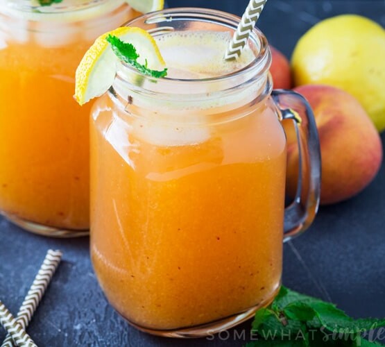 mason jars filled with fresh peach lemonade