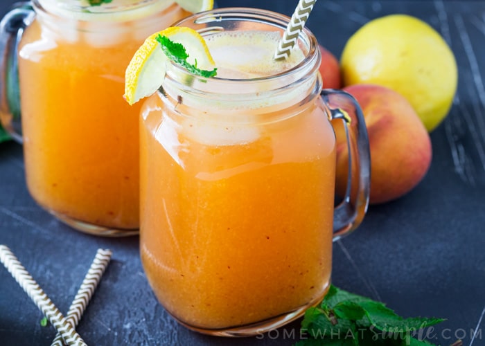 mason jars filled with fresh peach lemonade