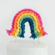 a rainbow yarn cake topper