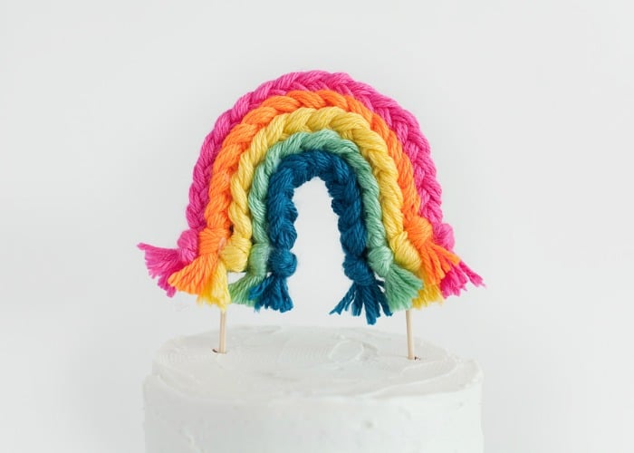 a rainbow yarn cake topper