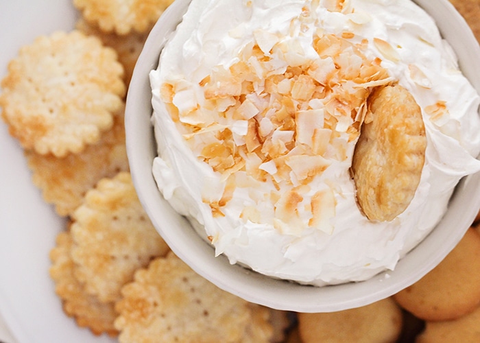 bowl of coconut dip with shredded coconut on top