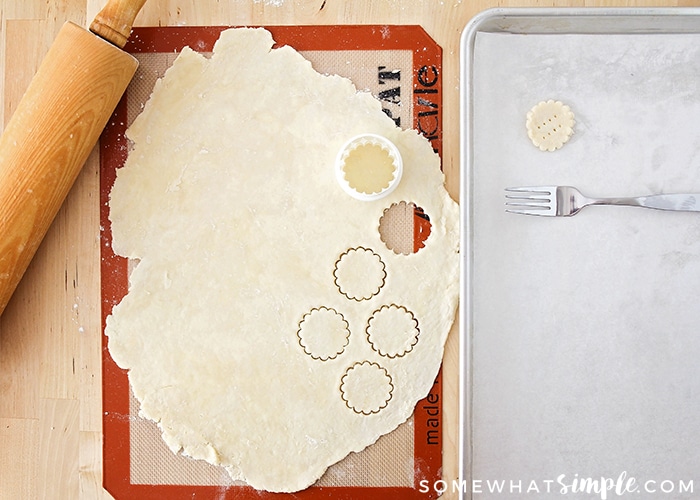 cutting out pie crust with a cookie cutter