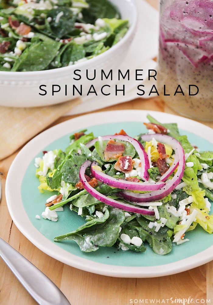 This spinach salad and poppyseed dressing pairs great with a hot day and is the perfect side dish for an outdoor party or BBQ! via @somewhatsimple