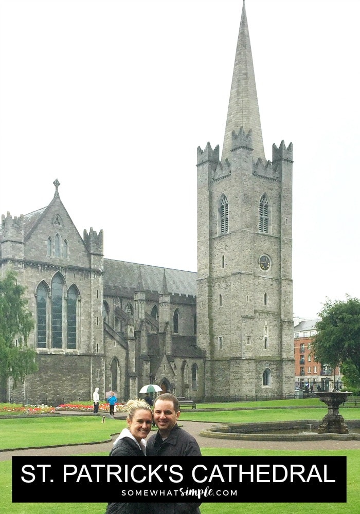 a beautiful blonde standing with her husband with St Patricks Cathedral in Dublin behind them