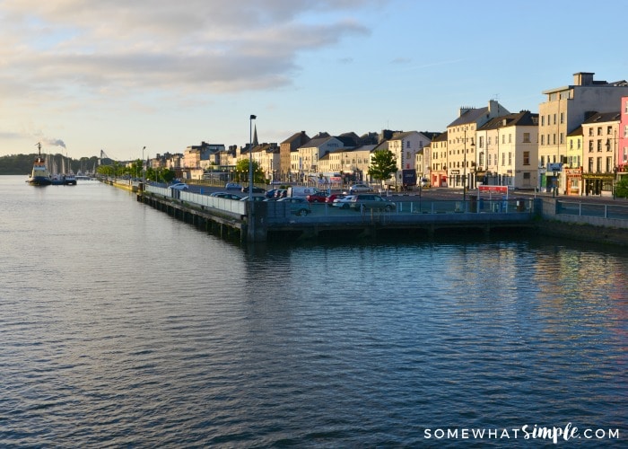 looking down the docks of Waterford Ireland with cars and buildings in the background