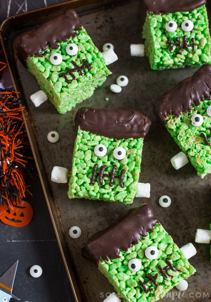 a tray of rice krispies treats that have been decorated to look like Frankenstein for Halloween