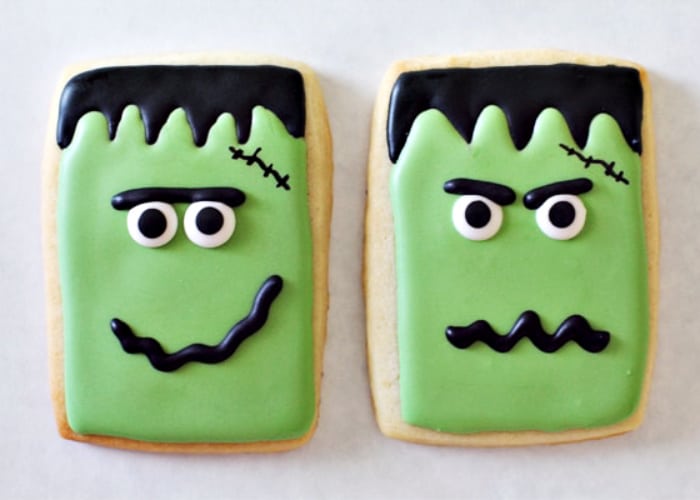 two cookies decorated to look like frankenstein