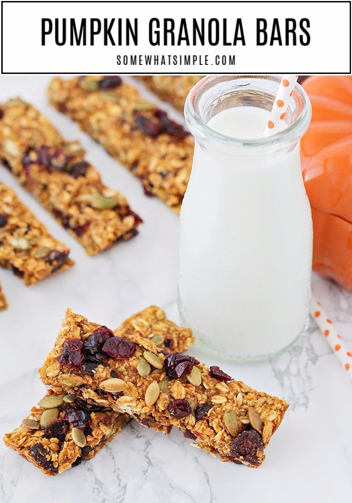 Pumpkin Granola Bars are a healthy fall snack that's made with dried cranberries and pumpkin seeds. They're super easy to make, full of delicious ingredients and they're perfect for breakfast or to have as a snack on the go. via @somewhatsimple