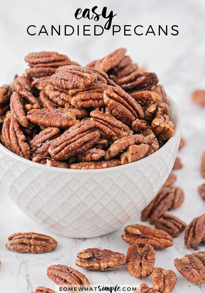 These delicious candied pecans have a sweet crunch and a touch of cinnamon. Covered in a brown sugar and cinnamon mixture, they're perfect for holiday gifts or party snacks! The recipe is super easy to make and perfect to enjoy throughout the holiday season. via @somewhatsimple