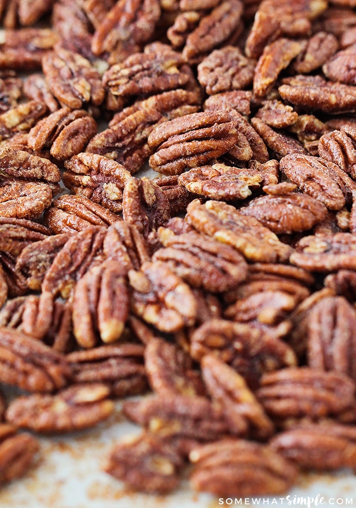 a baking sheet filled with baked pecans