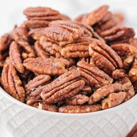 a bowl filled with candied pecans