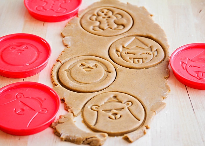 gingerbread cookie dough that has cookie cutter impressions