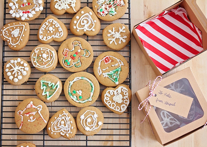 a cooling rack filled with decorated gingerbread cookies