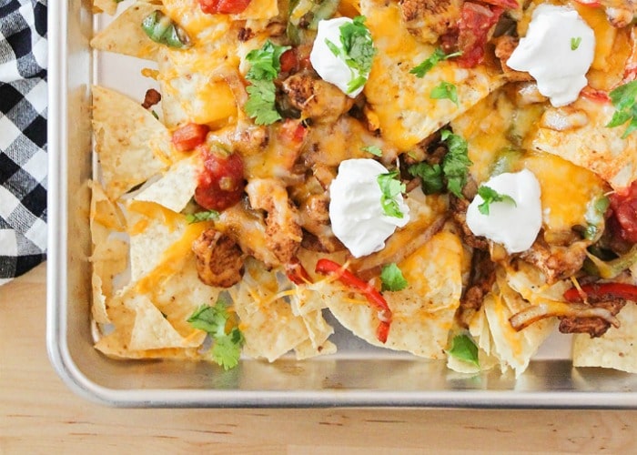 Chicken Fajita Nachos in a metal serving dish is easily one of my family's favorite super bowl foods