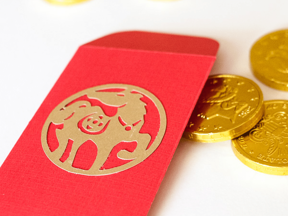 chinese new year red envelopes with gold candy coins