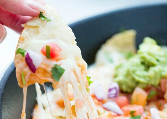 Ultimate Nachos in a skillet are an easy super bowl food idea