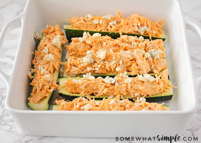 slices of zucchini topped with a buffalo chicken filling