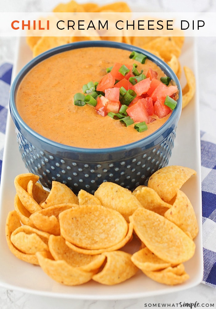 This delicious Chili Cream Cheese Dip is made with just 2 ingredients and is ready in less than ten minutes! It's quick, easy and sure to be a crowd favorite! #chilidip #creamcheese #dip #easyappetizer #chilicreamcheesedip via @somewhatsimple