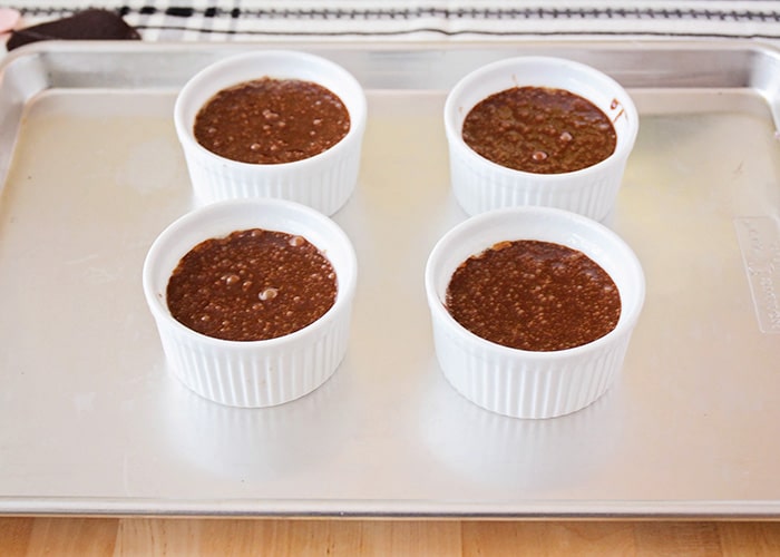 chocolate cake batter in small baking dishes