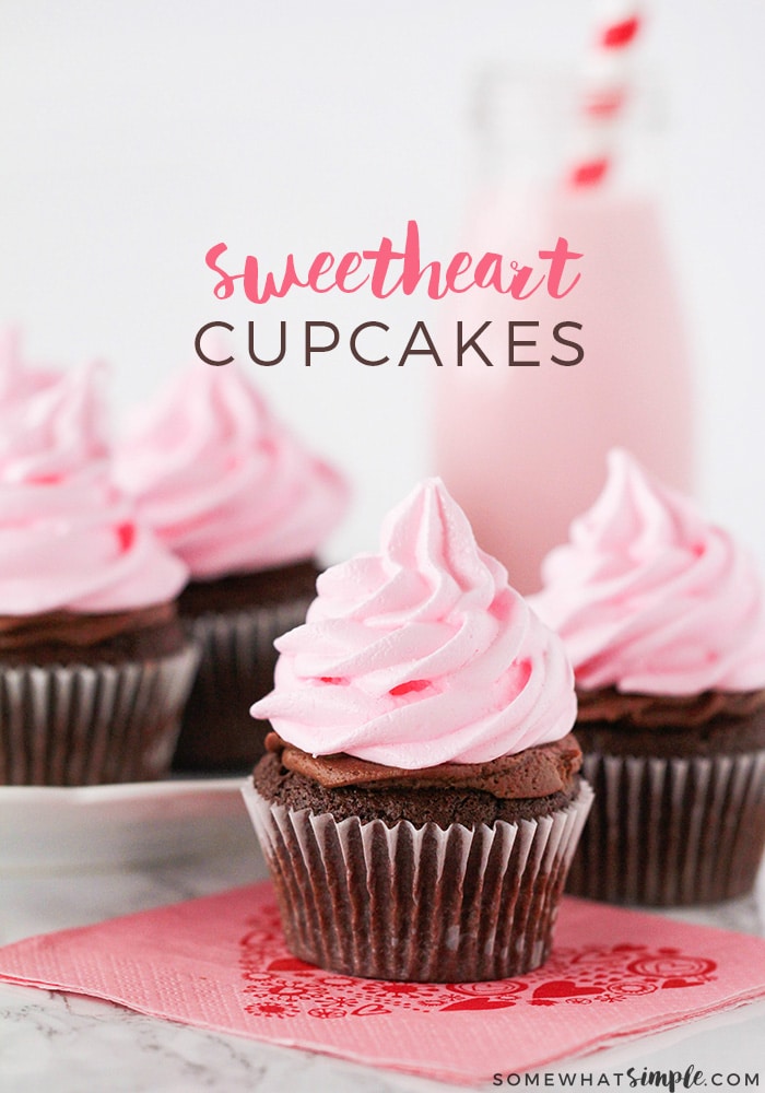 These delicious little sweetheart cupcakes start with one of my new favorite treats - pink meringue cookies.  They're super easy to make and are fun way to top off your cupcakes.  #cupcakes #meringue #cookies via @somewhatsimple