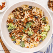 Finished dish of Broccoli Grape Pasta Salad in a white bowl