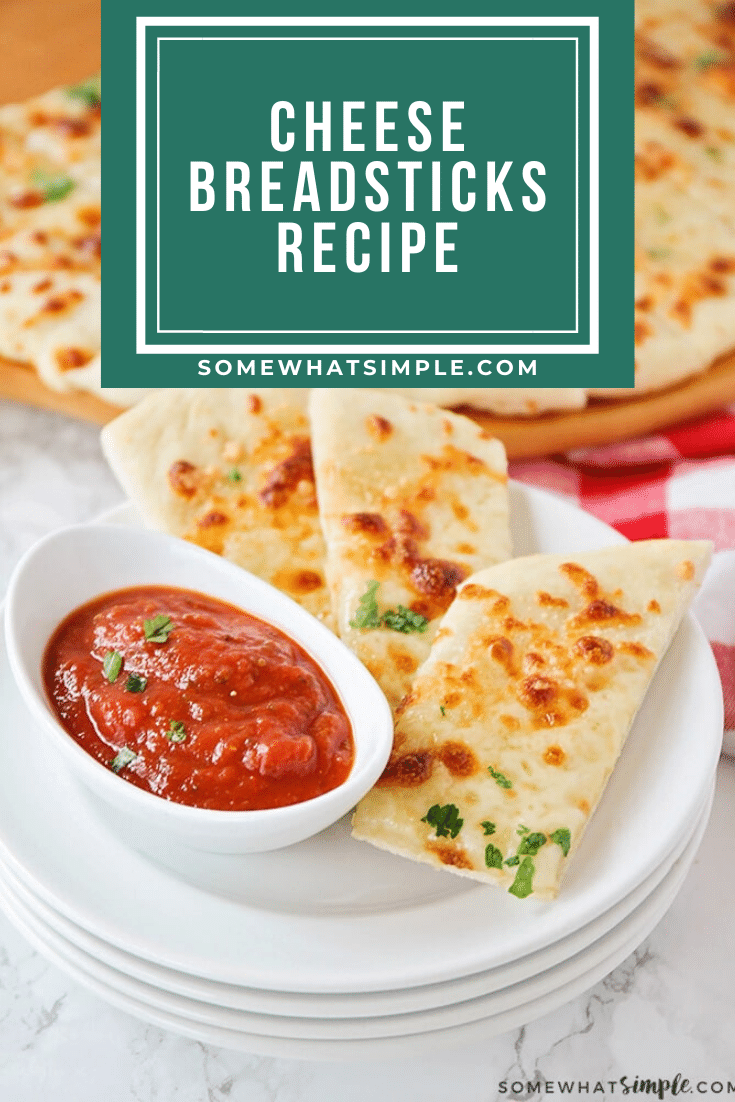 These cheesy breadsticks are so easy, they only take 30 minutes to make from start to finish. You can enjoy these homemade breadsticks as an appetizer or side dish and go great with any meal. #cheesebreadsticks #homemadecheesebreadsticks #cheesybreadsticks #easybreadrecipe #cheesebreadsticksrecipe via @somewhatsimple