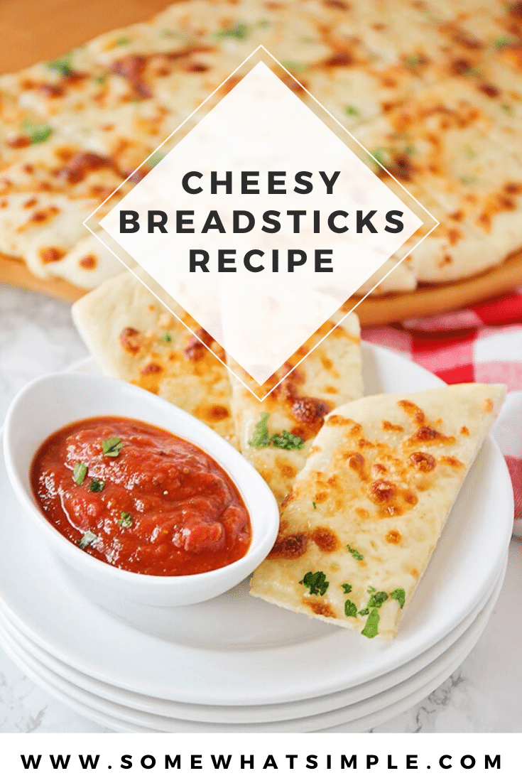 These cheesy breadsticks are so easy, they only take 30 minutes to make from start to finish. You can enjoy these homemade breadsticks as an appetizer or side dish and go great with any meal. #cheesebreadsticks #homemadecheesebreadsticks #cheesybreadsticks #easybreadrecipe #cheesebreadsticksrecipe via @somewhatsimple