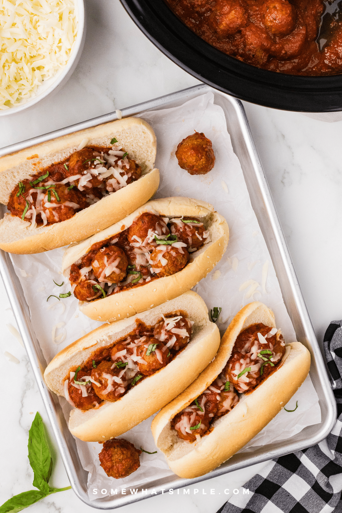 long image overhead shot of 4 Meatball Sandwiches