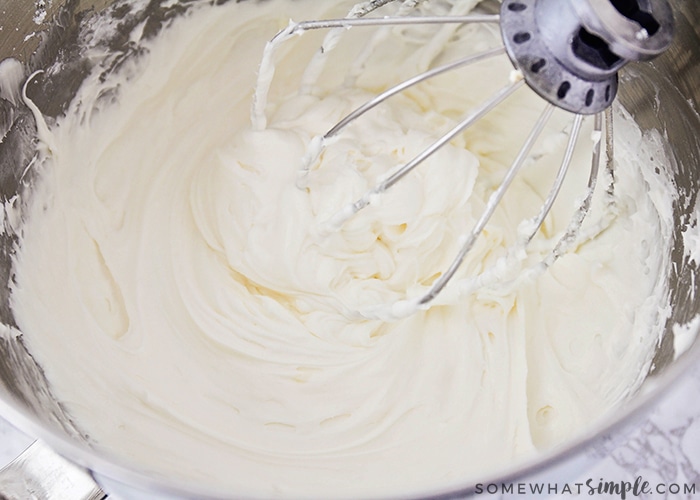 making this easy cream cheese frosting in a mixing bowl with the blade in the frosting