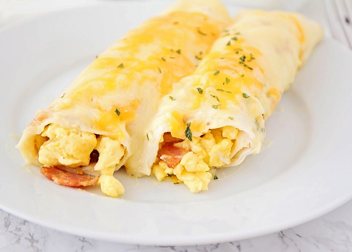 breakfast enchiladas made with eggs and bacon