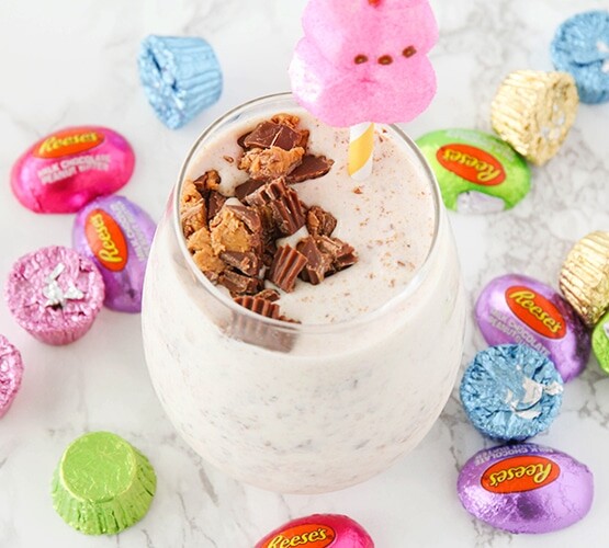 Candy Milkshakes surrounded by a bunch of easter candy on the counter