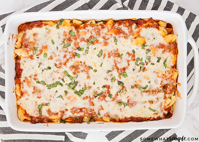 a baking pan filled with baked unstuffed shells just out of the oven