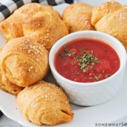 homemade pizza rolls plated with marinara sauce