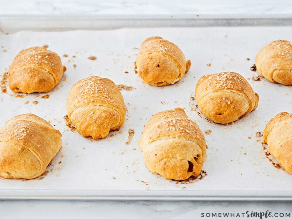 pizza rolls baked and on a baking sheet