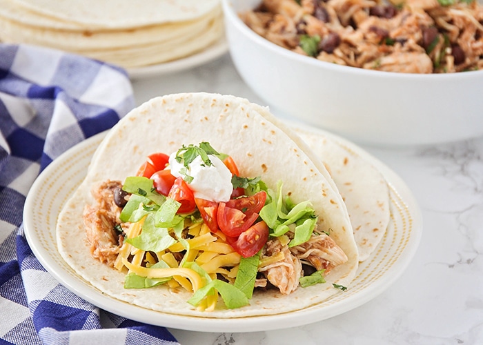 a shredded chicken taco made in a slow cooker