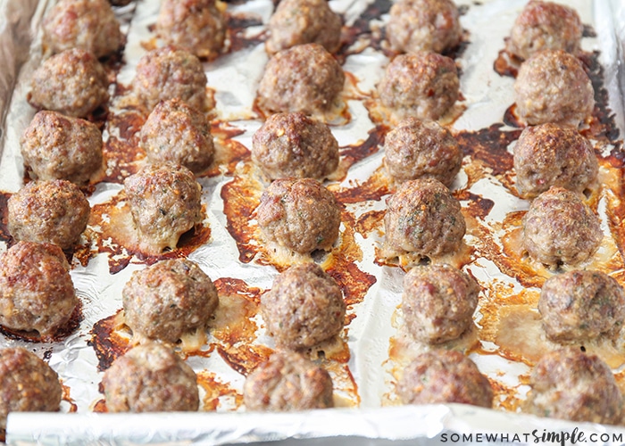 a tray of these simple homemade baked meatballs that are fully baked taken right out of the oven