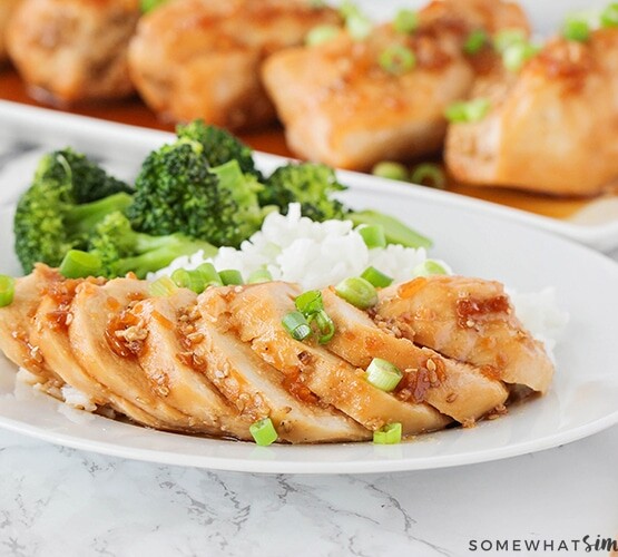 slices of teriyaki chicken with rice and broccoli