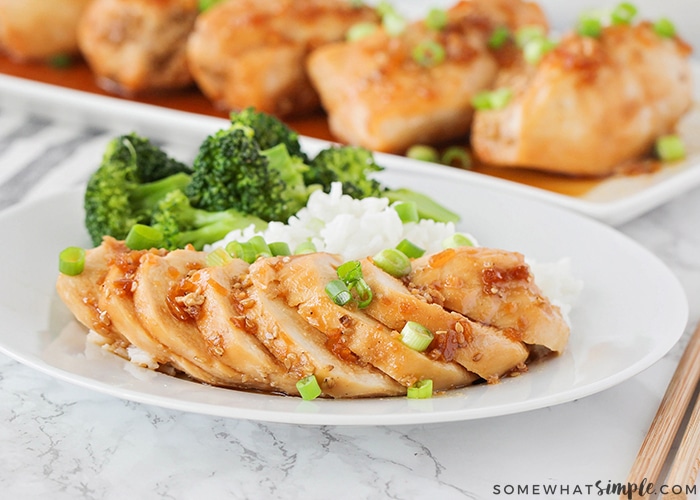 slices of teriyaki chicken with rice and broccoli