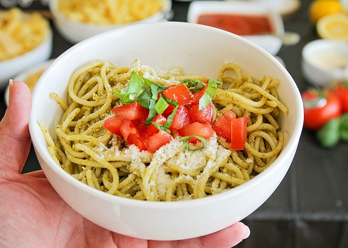 Host a fun and delicious dinner party at home with this easy Italian pasta bar! Mix and match pasta, sauce, and toppings to build the perfect bowl of pasta! 